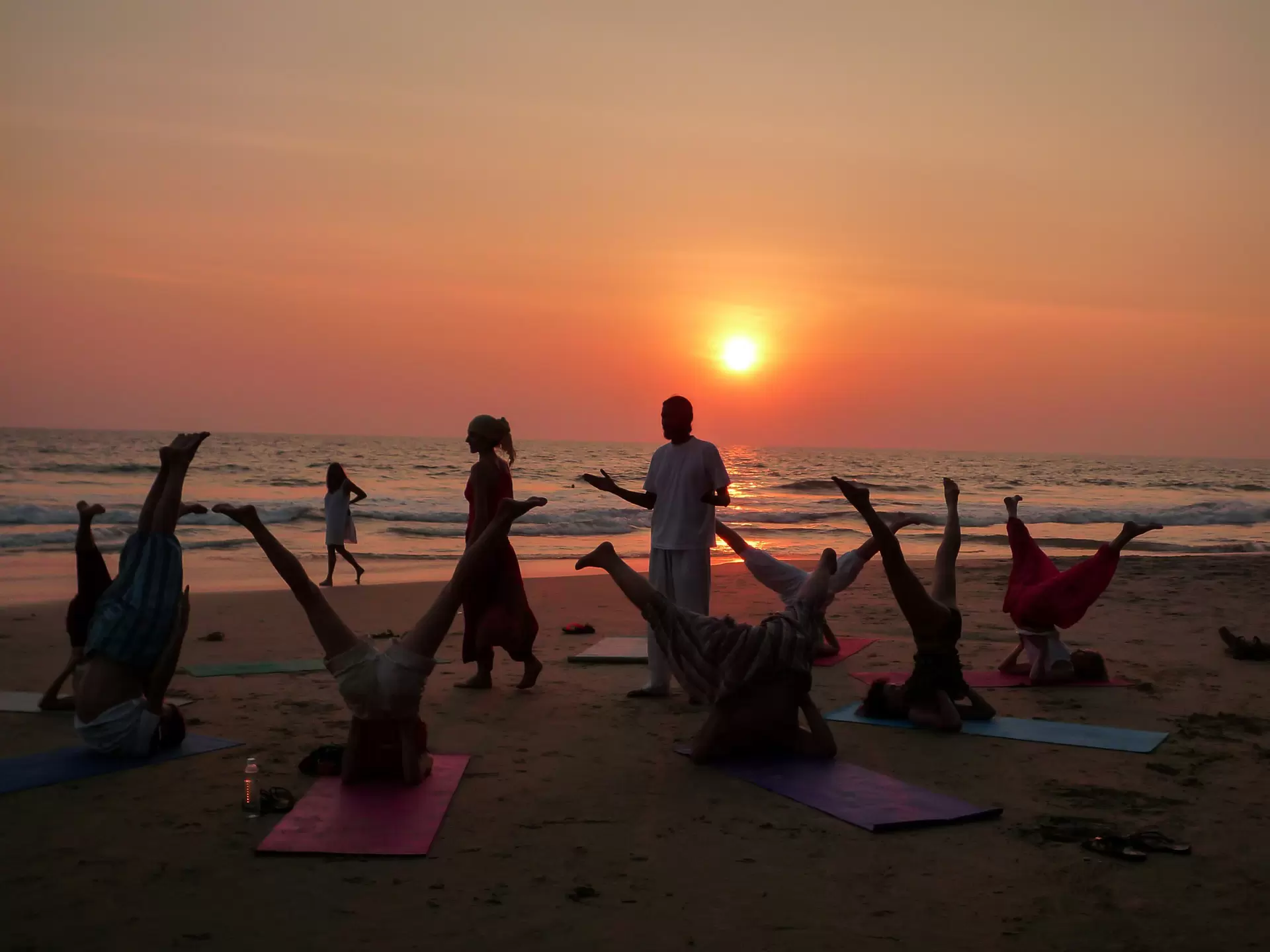 Beach yoga at sunset