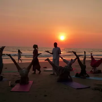 Beach yoga at sunset