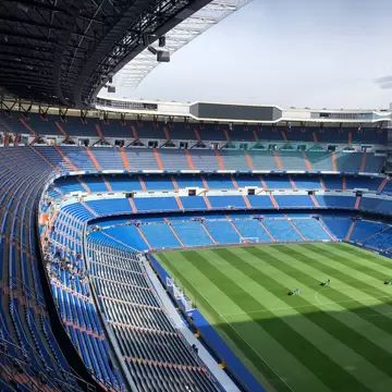View of the pitch and seats at Estadio Santiago Bernabéu in Madrid, Spain.