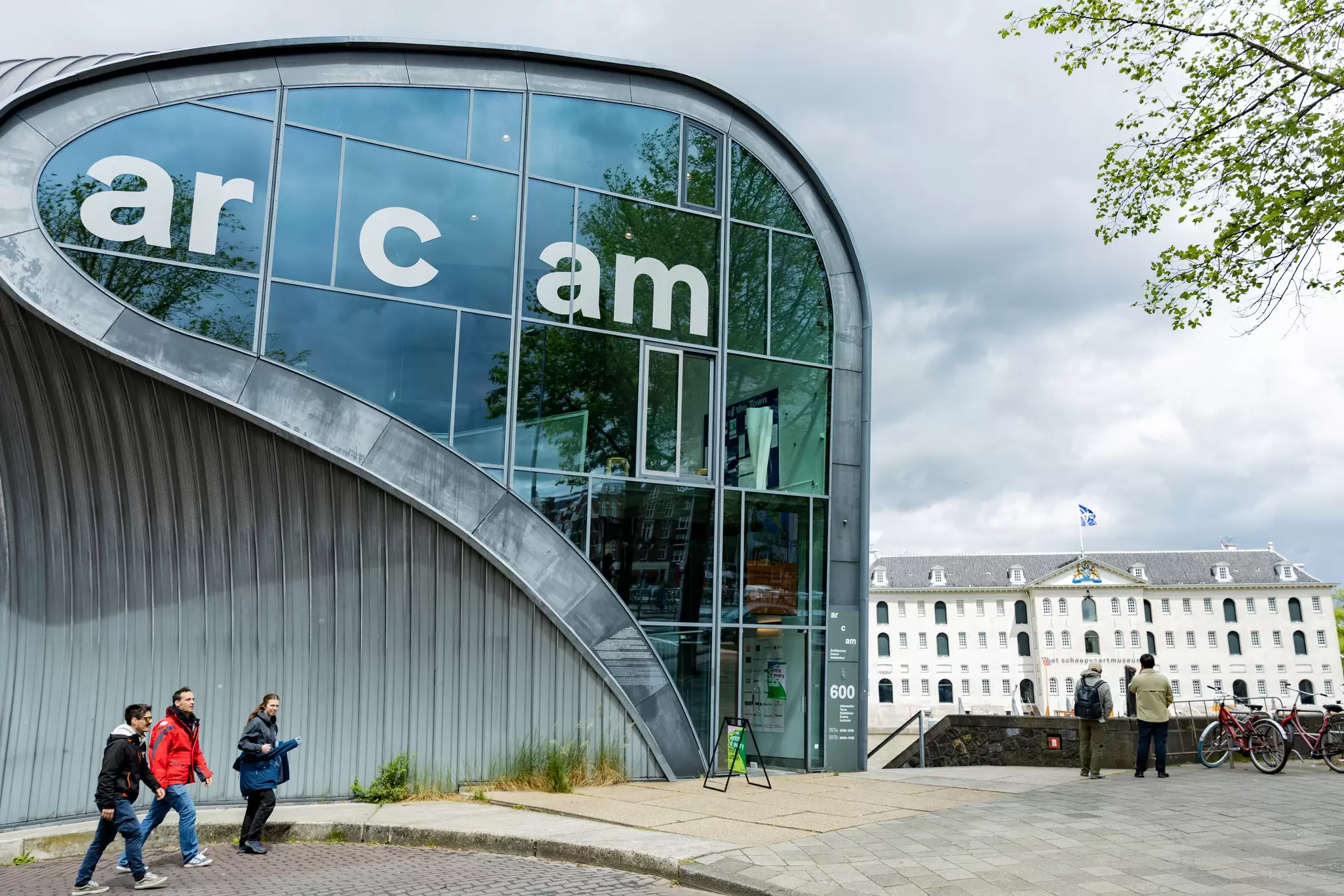 Exterior view of the Arcam building on a cloudy day in Amsterdam, Netherlands.