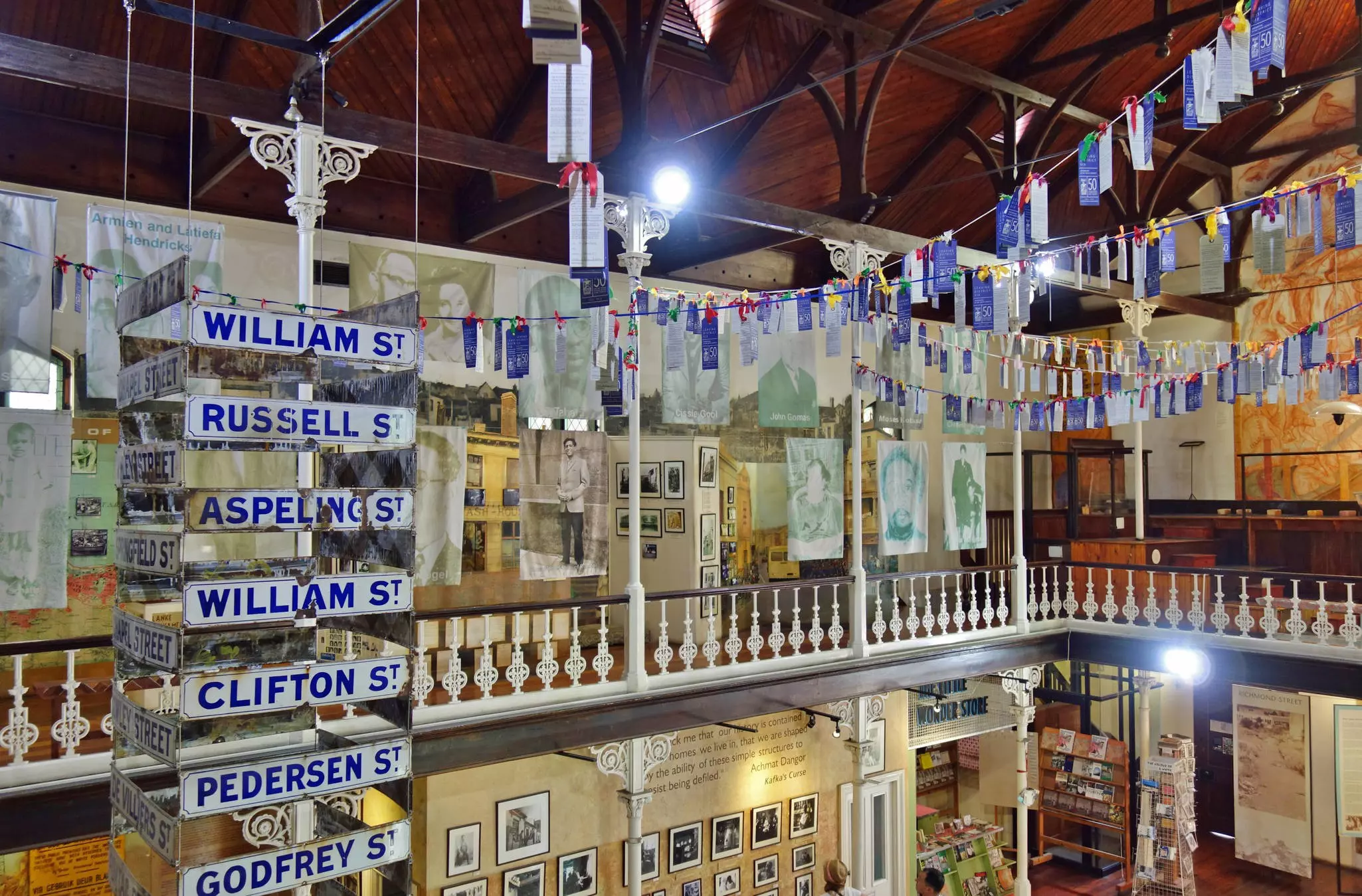 Exhibits of photos, ribbons and street signs in a museum