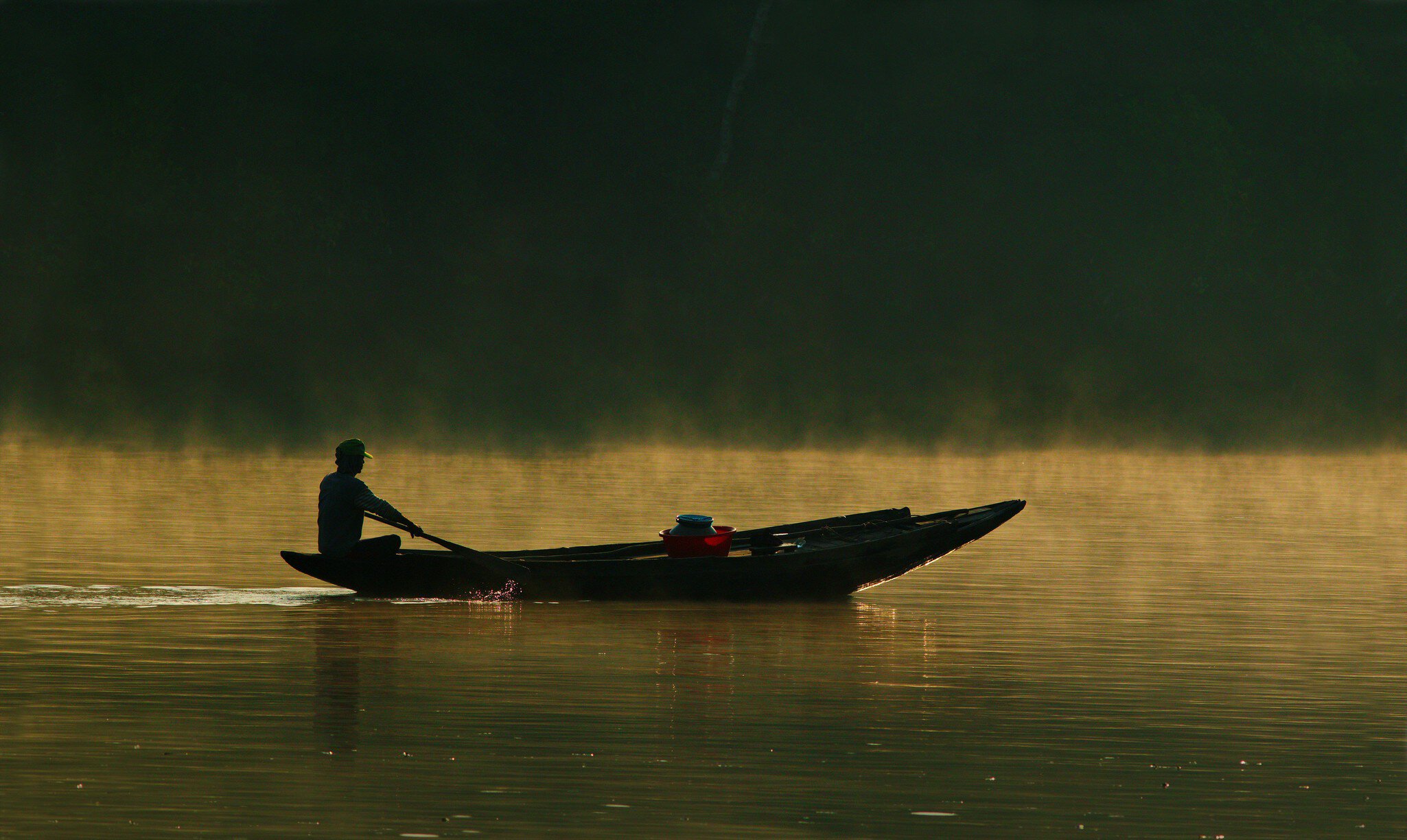 Boatman on water.