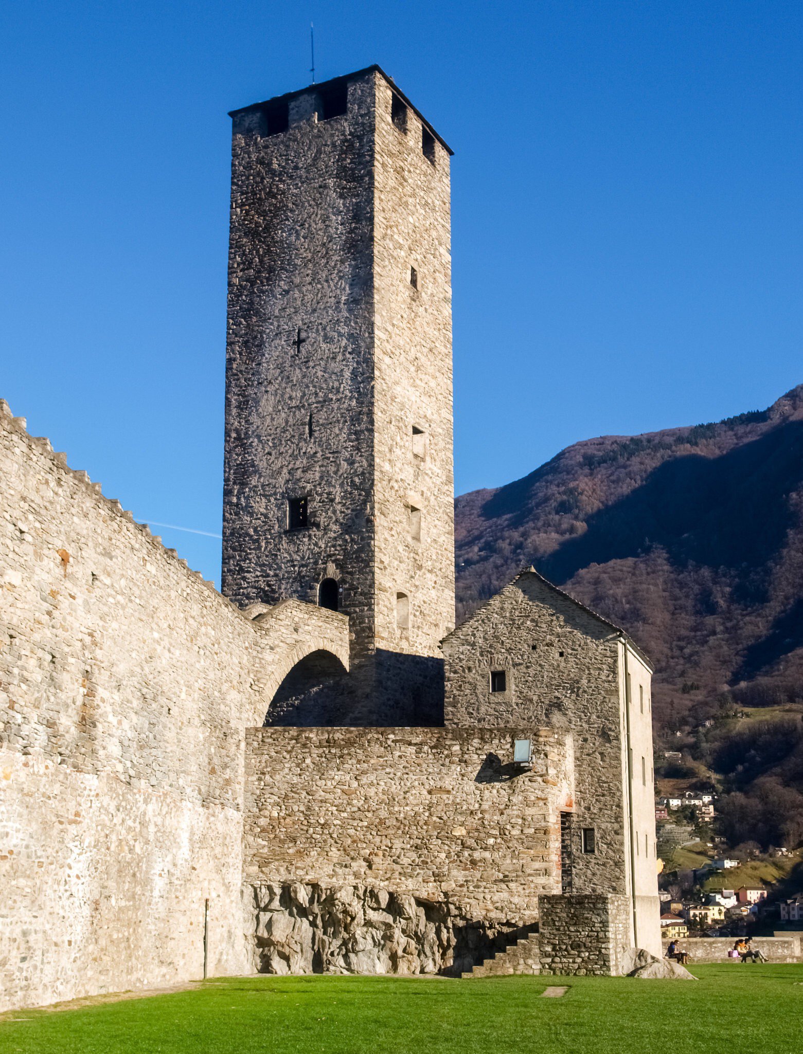 Bellinzona, Switzerland: a tower at Castelgrande with blue sky.