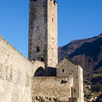 Bellinzona, Switzerland: a tower at Castelgrande with blue sky.