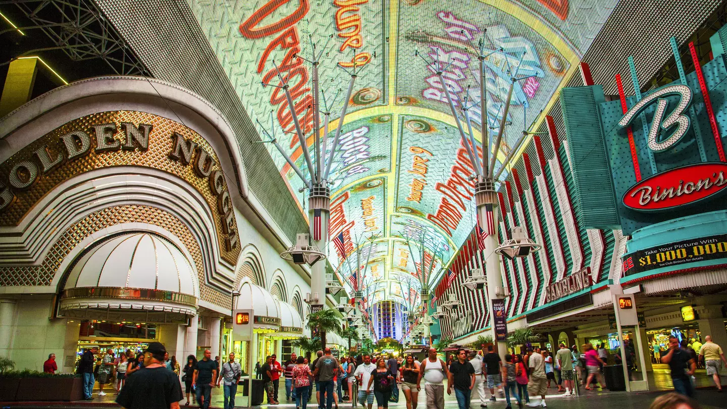 A wide shot of the people and casinos on Fremont St