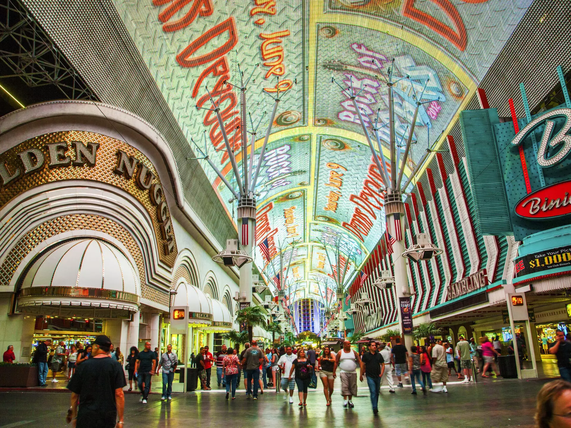 A wide shot of the people and casinos on Fremont St