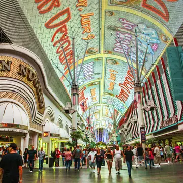 A wide shot of the people and casinos on Fremont St