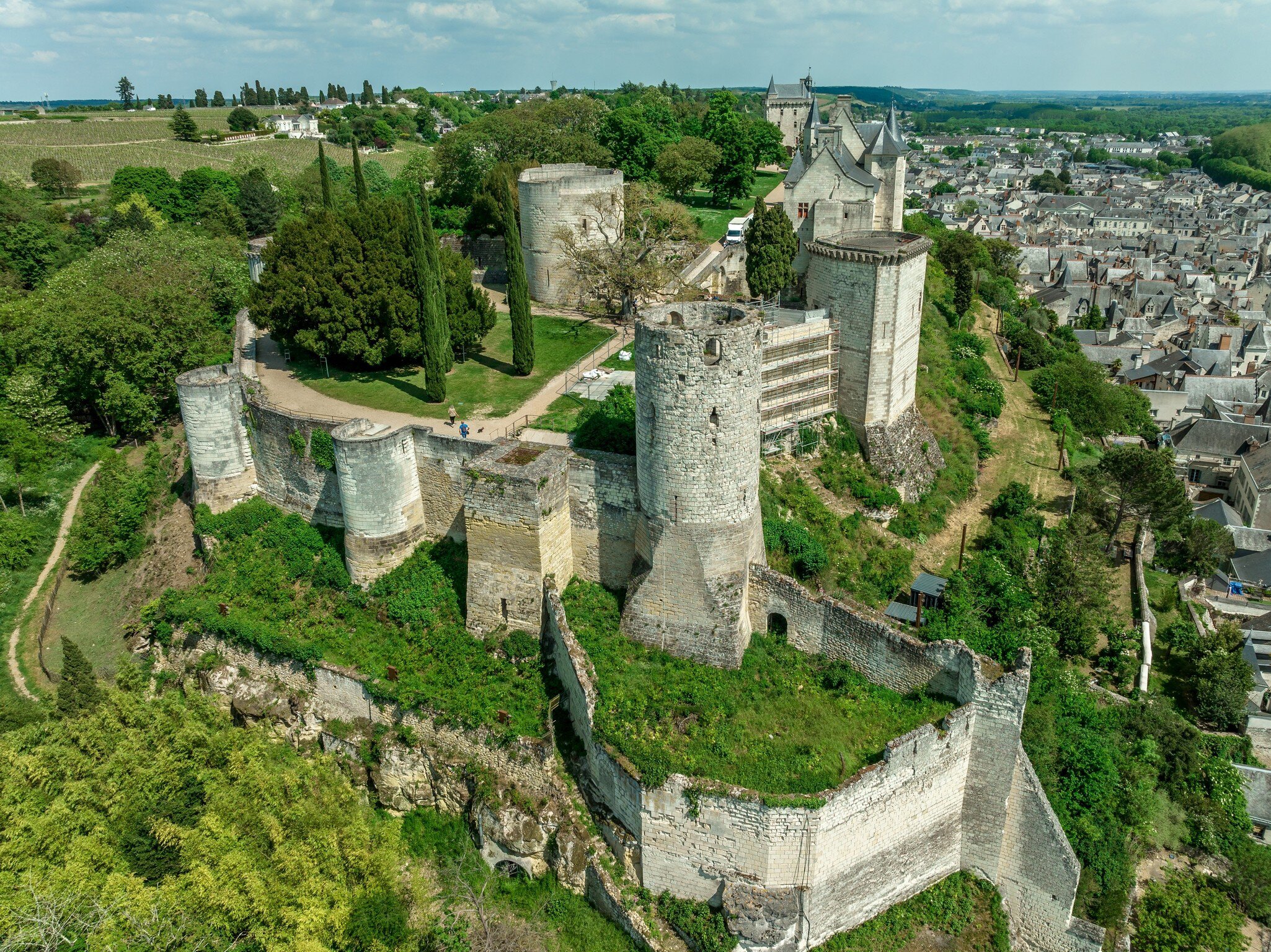 Aerial view of Fort du Coudray, Chinon castle's westernmost enclosure separated by a dry moat from the middle courtyard strengthened by rectangular and circular tower. Loire Valley, France.