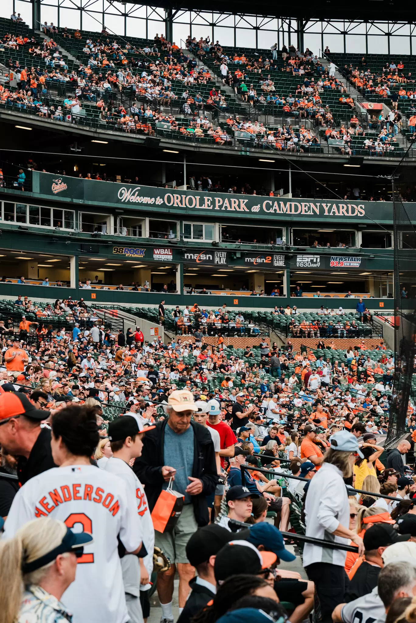 A crowd of baseball fans in the stands at Camden Yards Stadium