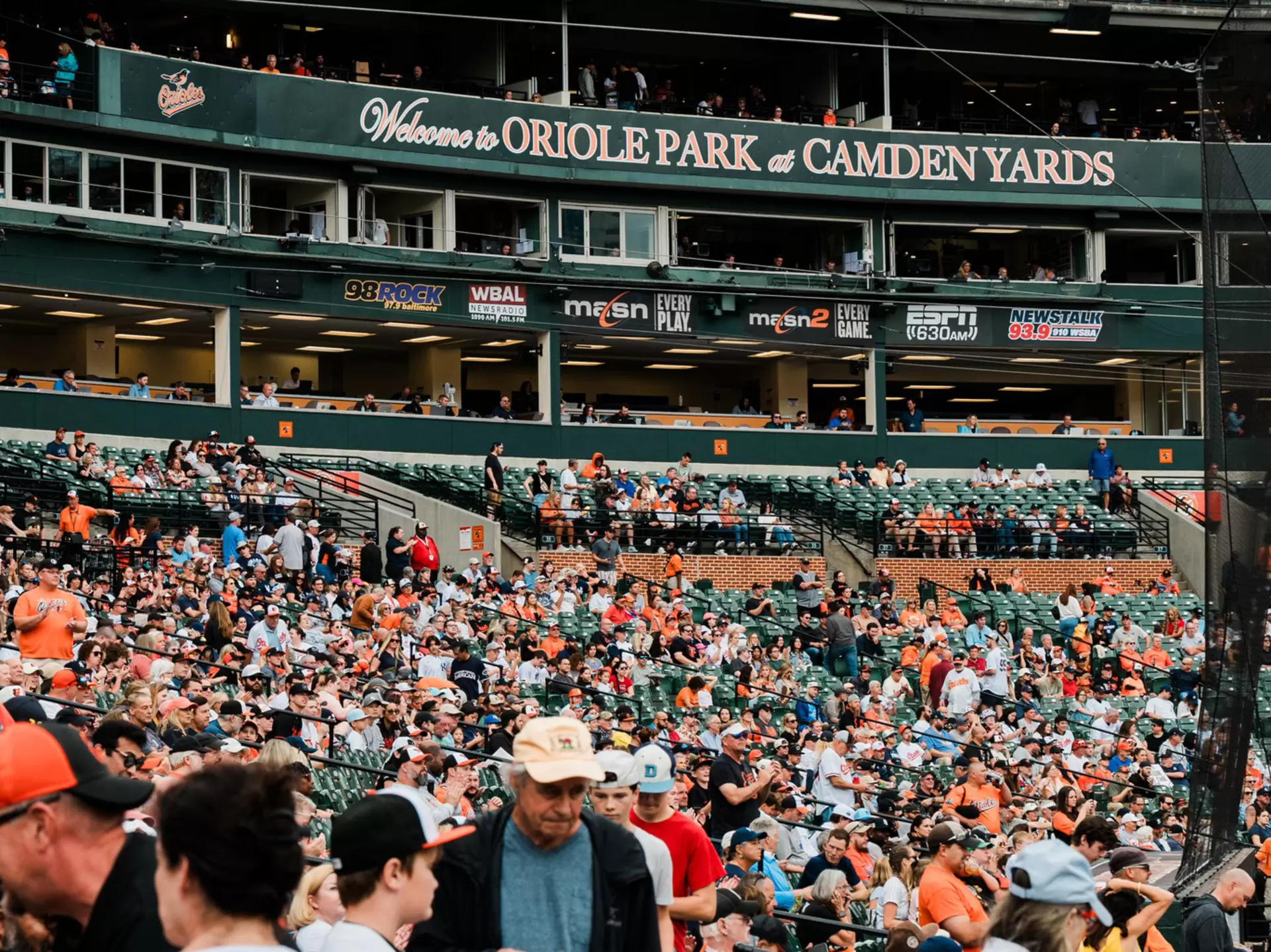 A crowd of baseball fans in the stands at Camden Yards Stadium
