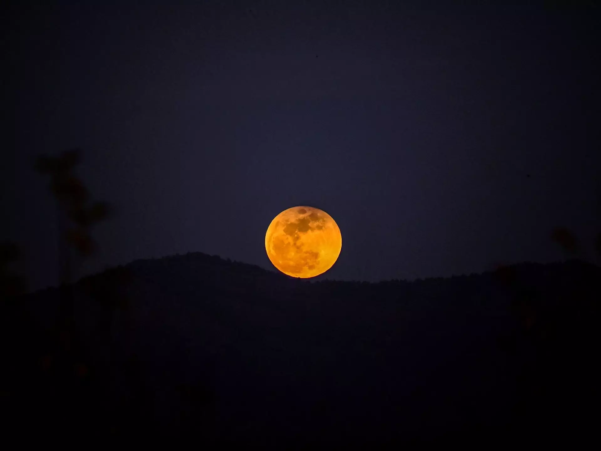A picture taken on January 31, 2018 shows the moon rising behind a mountain during a lunar eclipse, referred to as the "super blue blood moon" near Syria-Turkey border at the Hassa district in Hatay..Stargazers across large swaths of the globe had the chance to witness a rare "super blue blood Moon" on January 31, 2018, when Earth's shadow bathed our satellite in a coppery hue. The celestial show was the result of the Sun, Earth, and Moon lining up perfectly for a lunar eclipse just as the Moon is near its closest orbit point to Earth, making it appear "super" large.. / AFP PHOTO / OZAN KOSE        (Photo credit should read OZAN KOSE/AFP via Getty Images)
912687132
Horizontal