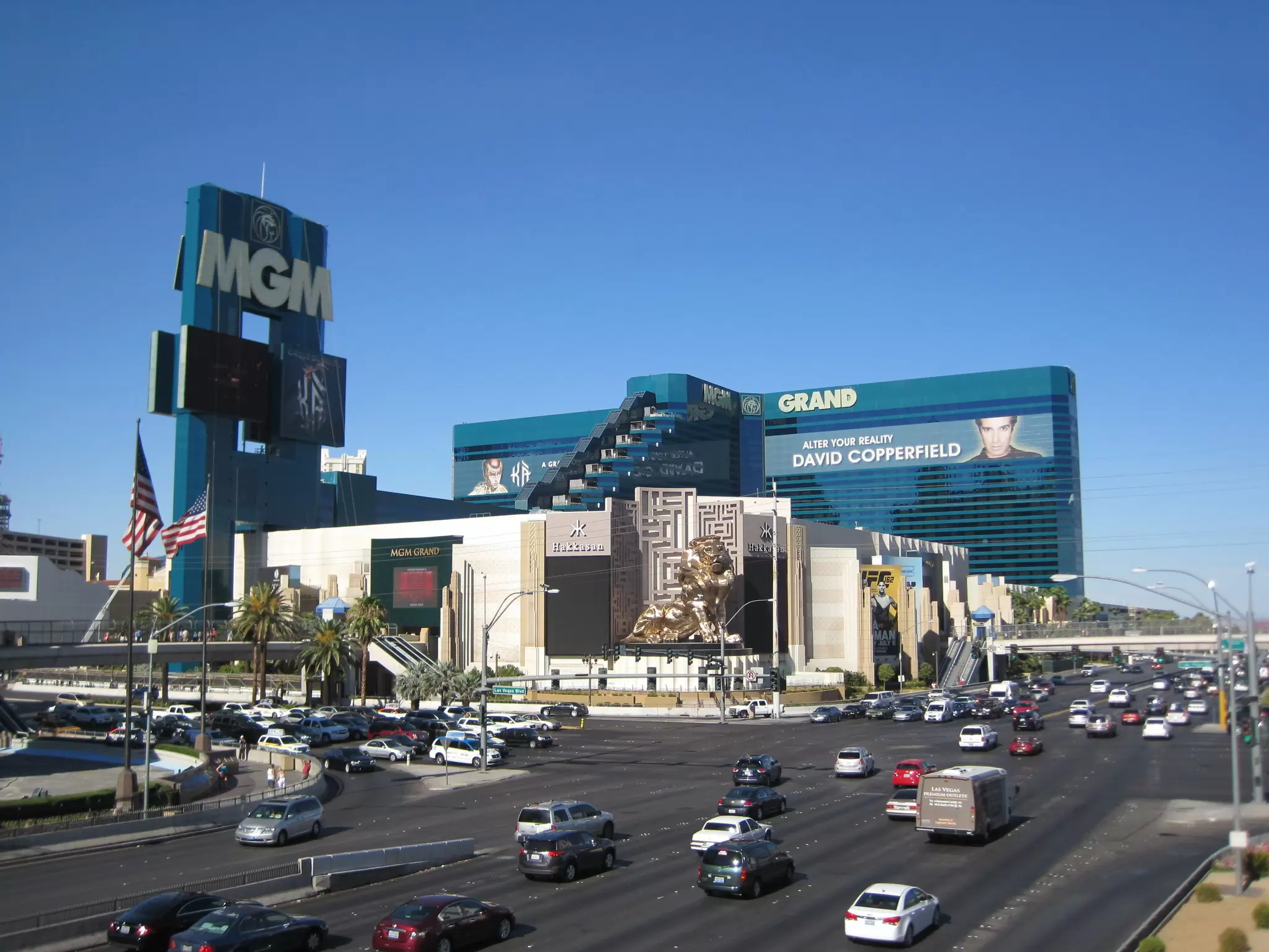 The exterior of The MGM Grand in Las Vegas as seen from across the Strip on a clear, blue, cloudless day.