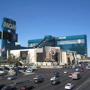 The exterior of The MGM Grand in Las Vegas as seen from across the Strip on a clear, blue, cloudless day.