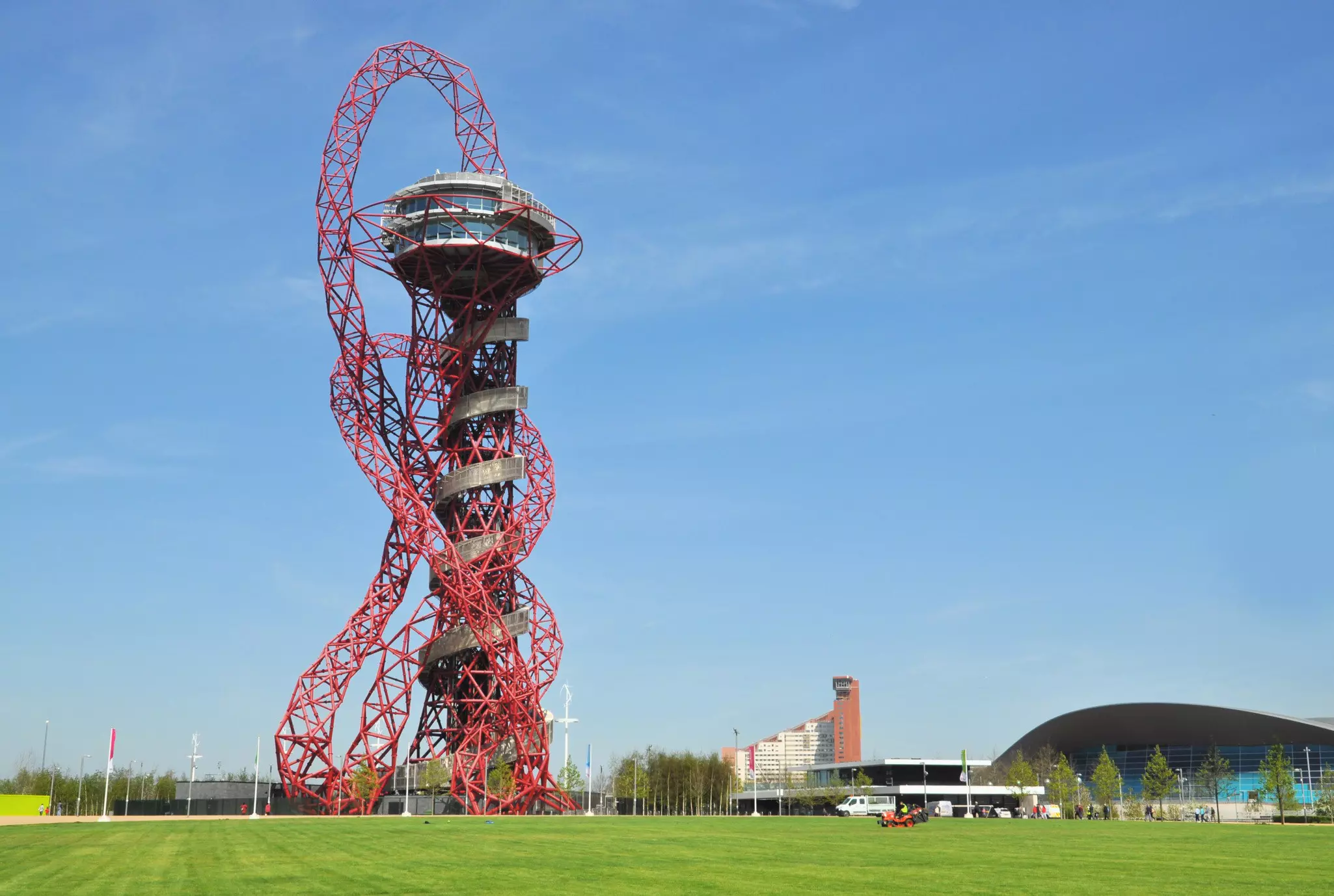 The tall, red ArcelorMittal Orbit is in the Queen Elizabeth Olympic Park
