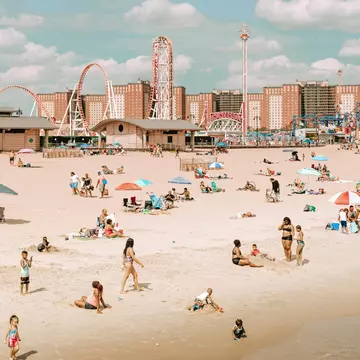 Coney Island's amusement parks stand tall behind the beach. Iryna Horbachova/Shutterstock
