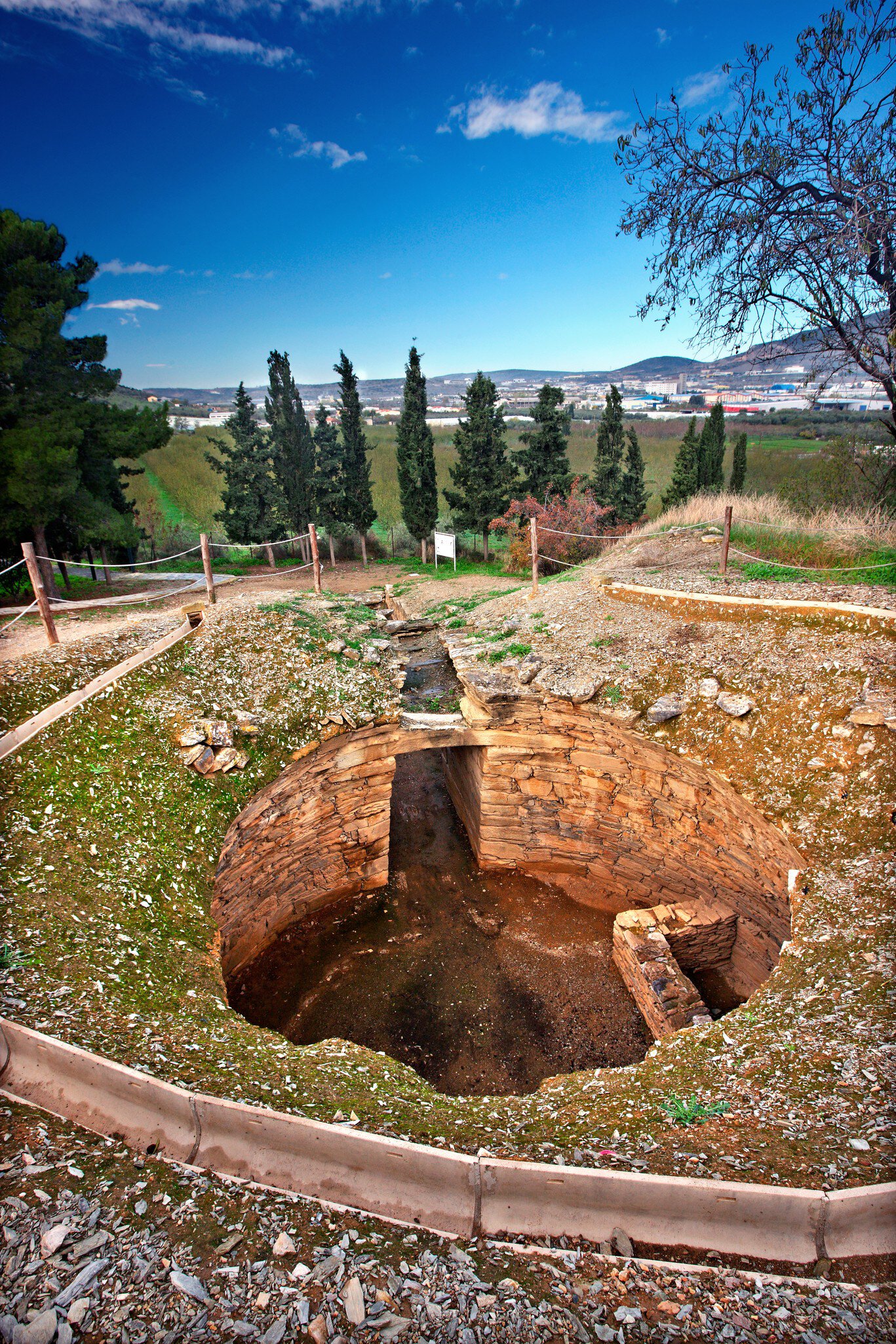 View of a Mycenaean vaulted tomb (Tholos) at the archaeological site of Ancient Dimini in Greece.
