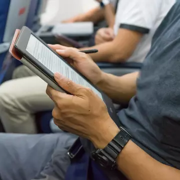 E-readers, tablets and even headphones can all have airplane modes too. ©Chun photographer/Shutterstock