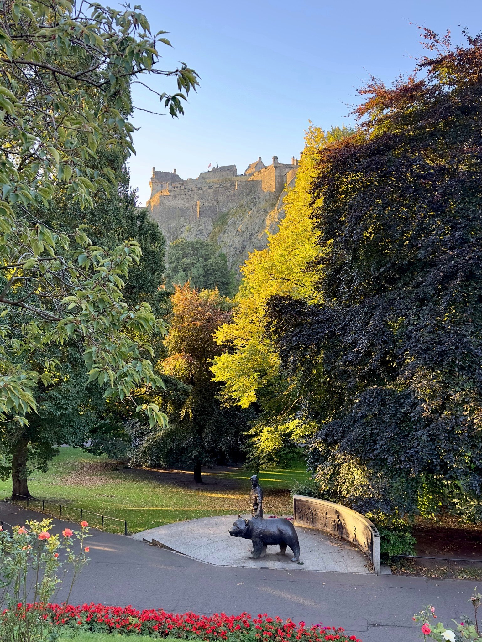 Wojtek the Soldier Bear memorial statue by Alan Herriot in Princes Street Gardens overlooked by Edinburgh Castle.
