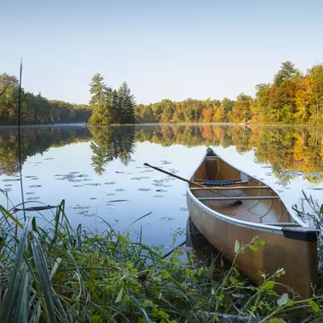 Canoe with paddle on shore of beautiful lake with island in northern Minnesota at sunrise
1358470404
fall, scenery