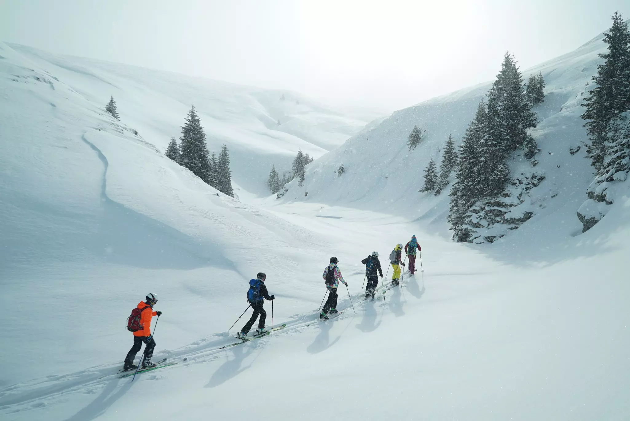 Group of touring skiers in the Carpathian Mountains, Romania.