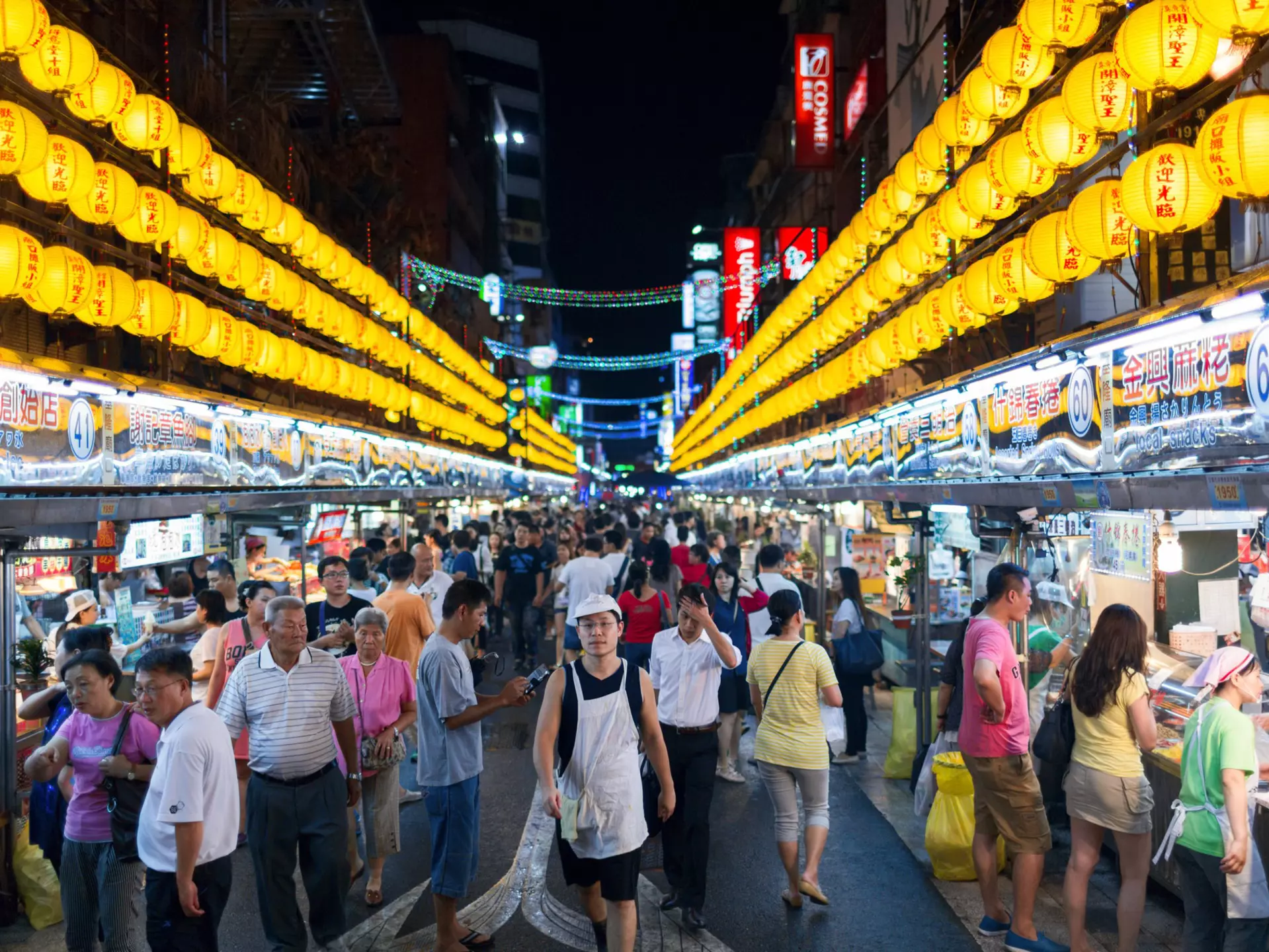 The street signs throughout Brick Lane feature plaques with the Bengali names for each street