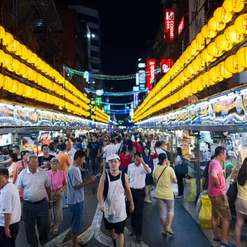 The street signs throughout Brick Lane feature plaques with the Bengali names for each street