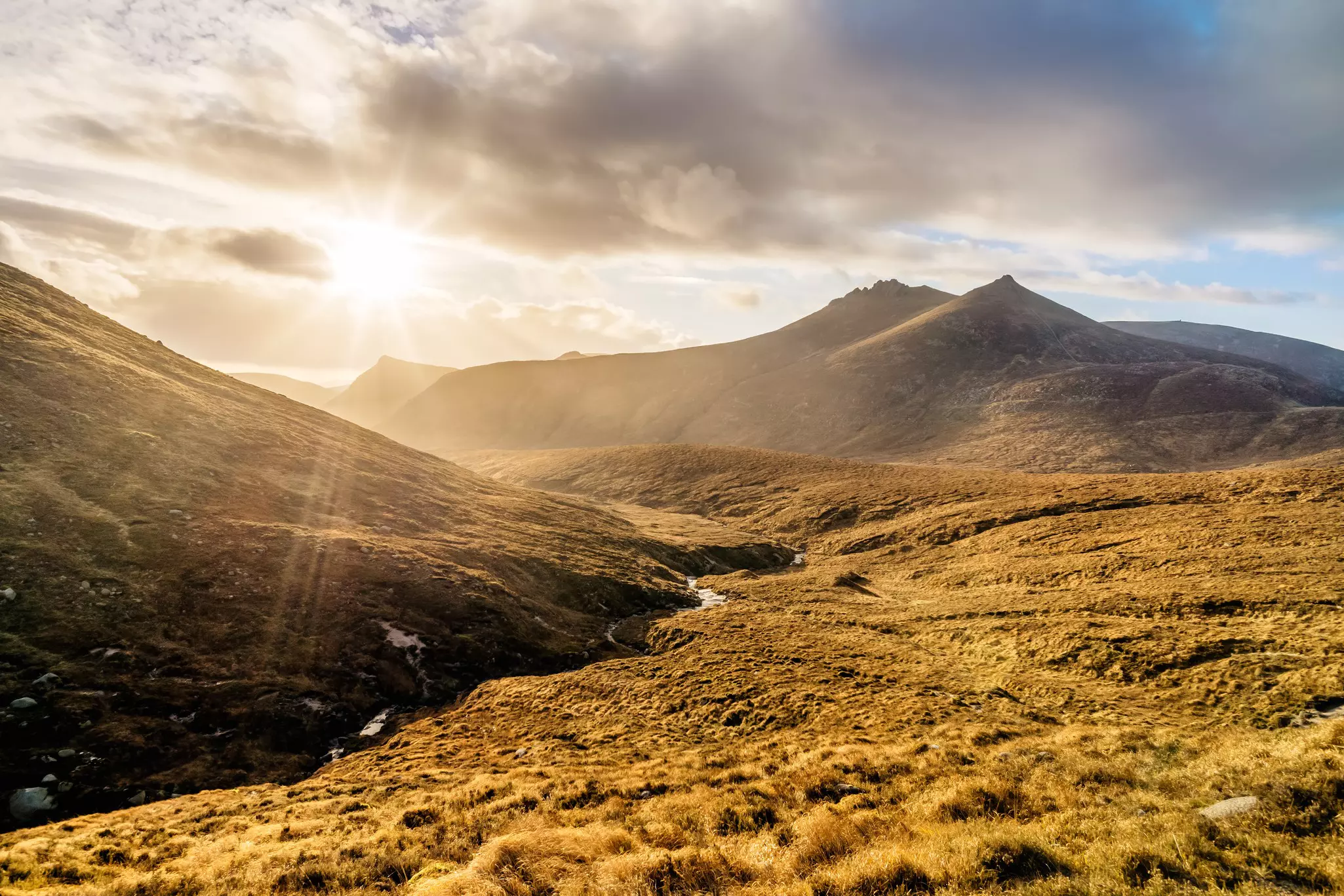 Sunset over autumn colored valley in the Mourne Mountains