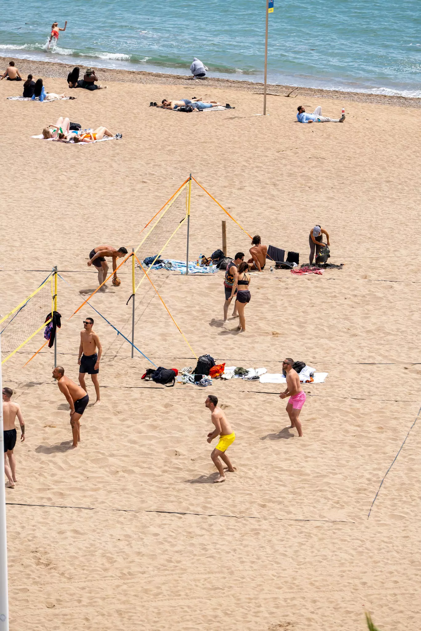 People playing volleyball at Barceloneta Beach