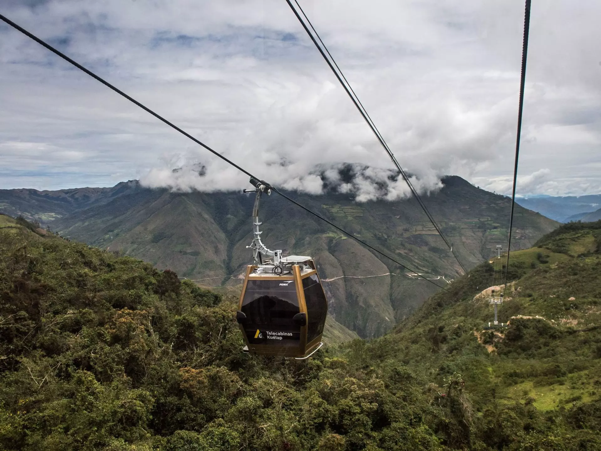 Tourists use a new cable car system to reach Kuelap, a fortified citadel built by the Chachapoya indigenous people between the 6th and 11th centuries, from the town of Nuevo Tingo, in the Amazon region in northern Peru, on March 15, 2017. The 4.4-km ca...