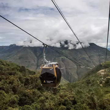 Tourists use a new cable car system to reach Kuelap, a fortified citadel built by the Chachapoya indigenous people between the 6th and 11th centuries, from the town of Nuevo Tingo, in the Amazon region in northern Peru, on March 15, 2017. The 4.4-km ca...