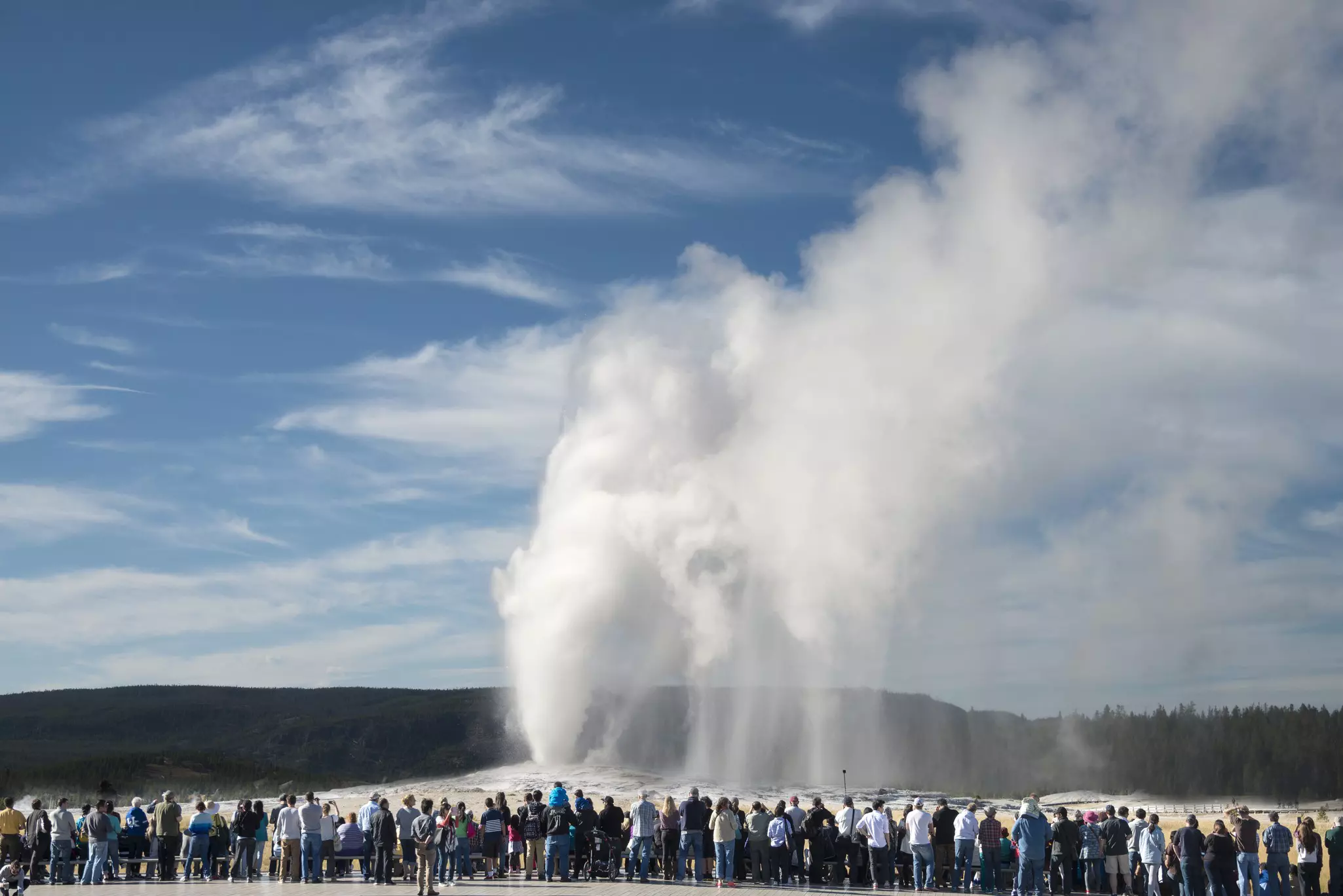 Crowd viewing the iconic Old Faithful geyser in Yellowstone National Park