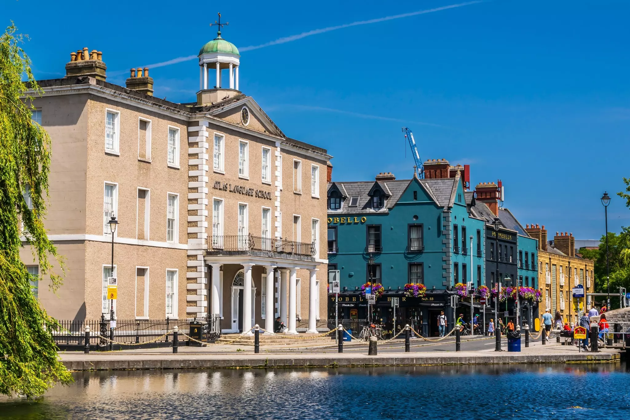 Canalside buildings, including a pub, on a sunny day