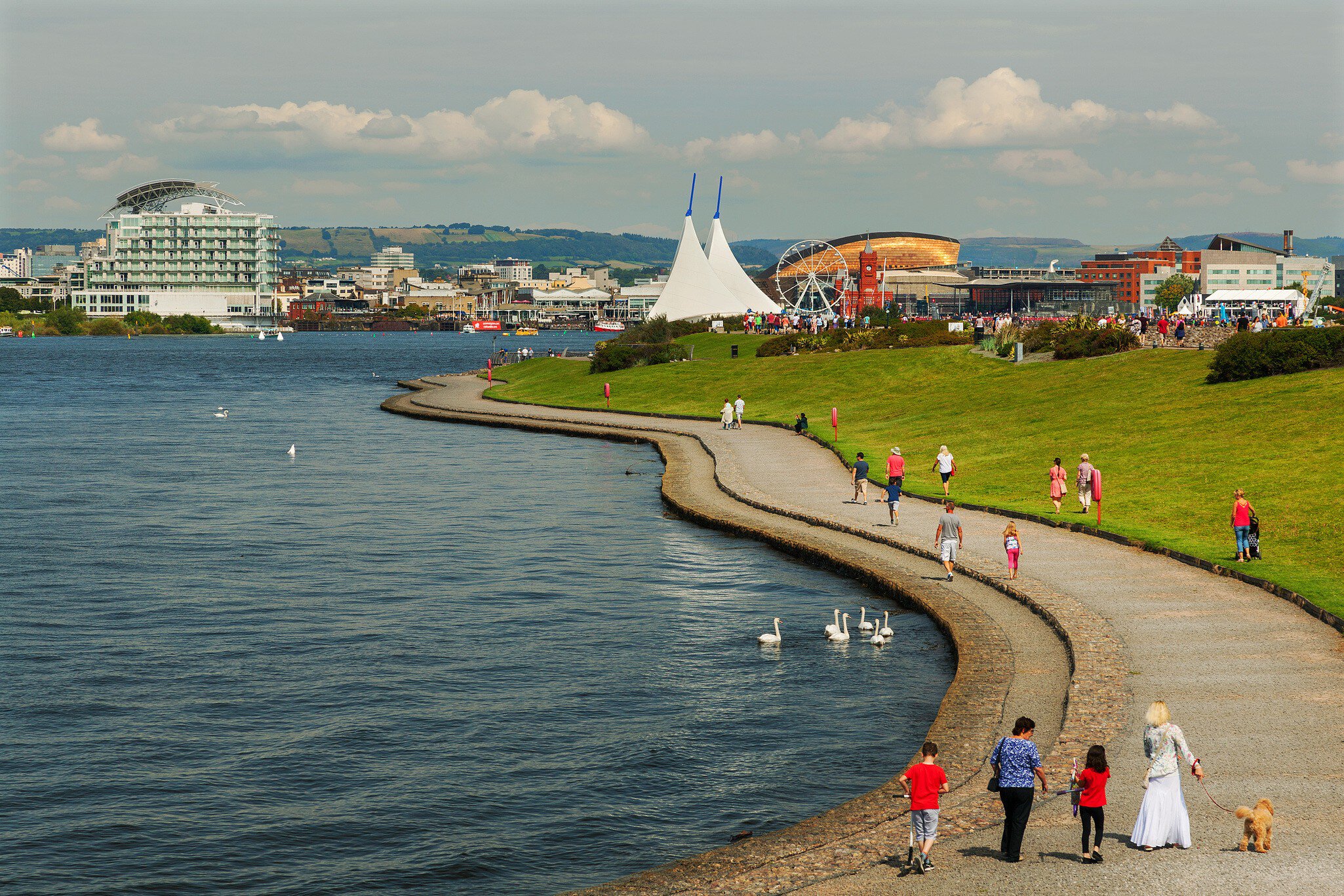 People walking along Barrage and Walkway at Cardiff Bay, Cardiff, Wales.