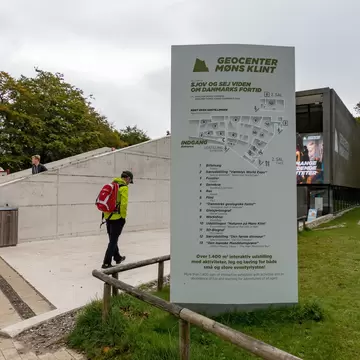 Monsklint, Denmark. A man walking at the entrance the Geocenter Museum.