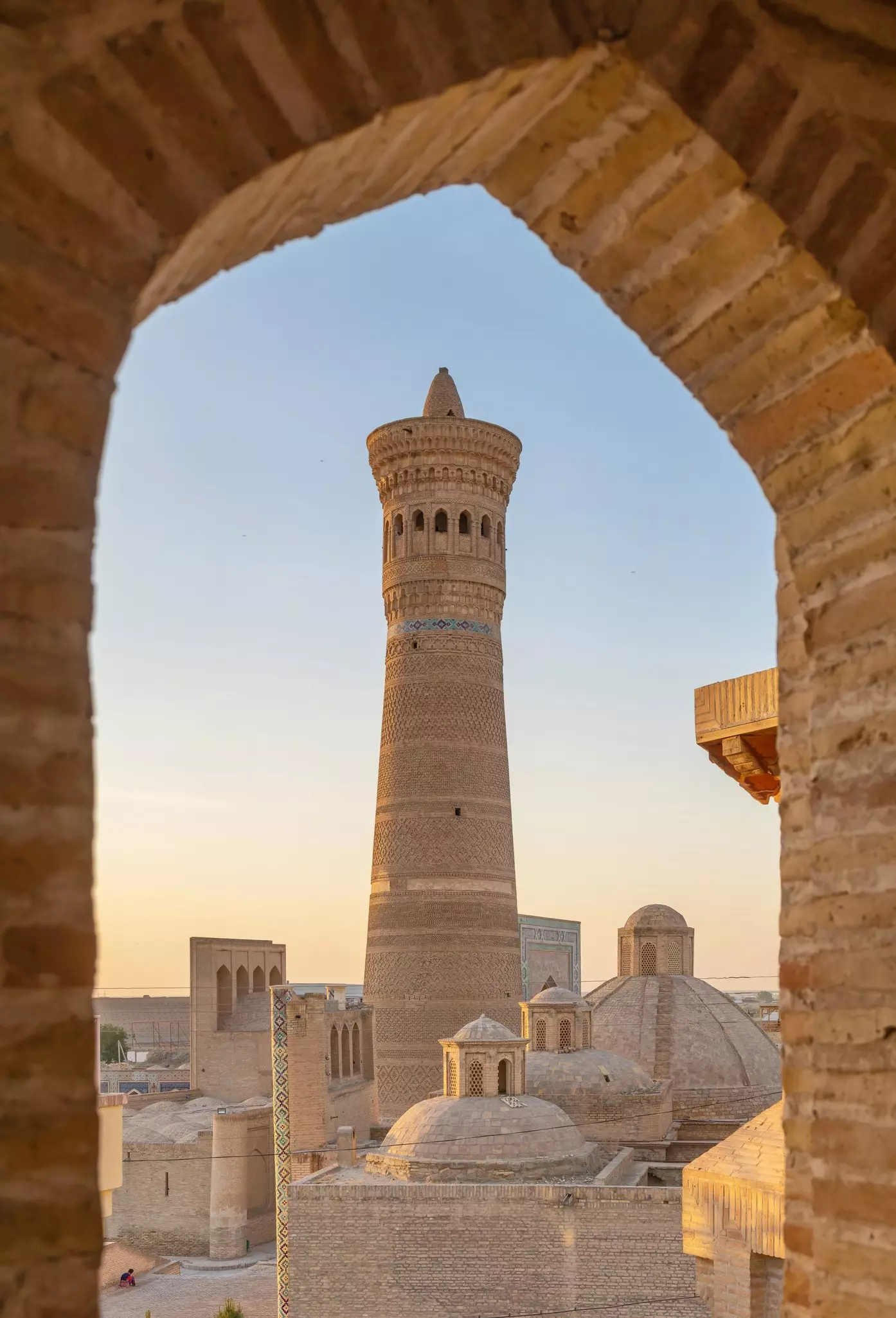 Bukhara, Uzbekistan. View of Kalon Minaret through the window on sunset, License Type: media, Download Time: 2025-03-18T20:28:35.000Z, User: rhylton_redventures, Editorial: false, purchase_order: 56530 - Guidebooks, job: Lonely Planet, client: Lonely Planet wip, other: Rhianydd Hylton
