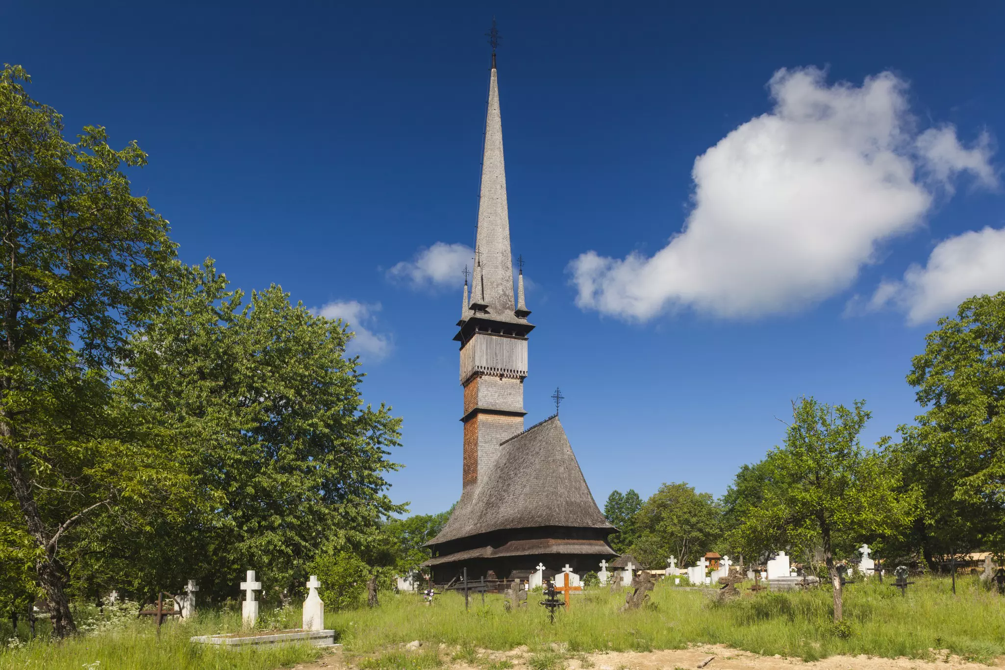 A historic wooden church in the village of Surdesti in the Maramures region, Romania.