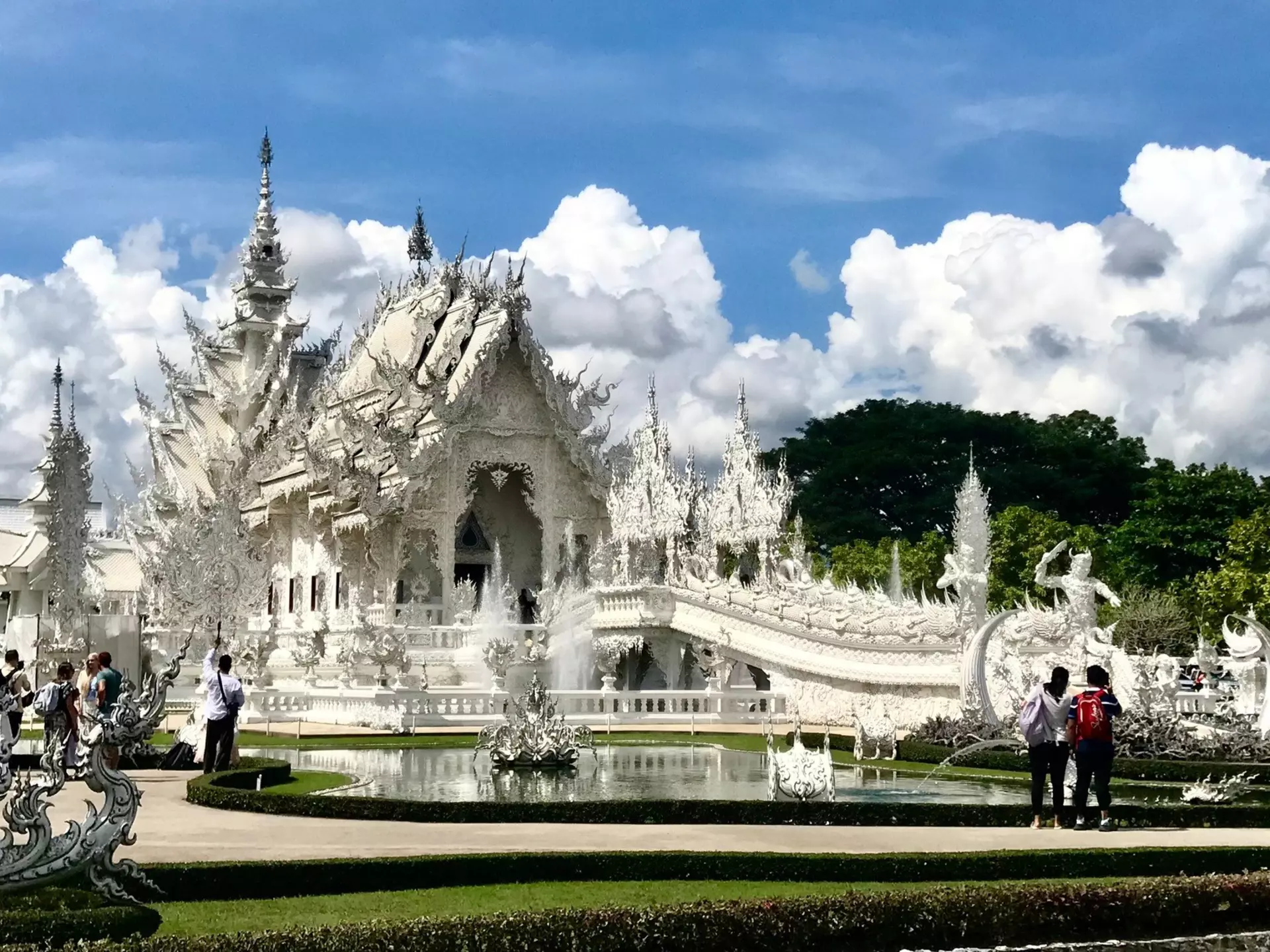 The gleaming frontage of Wat Rong Khun in Chiang Rai. John Gottberg Anderson for Lonely Planet