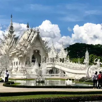 The gleaming frontage of Wat Rong Khun in Chiang Rai. John Gottberg Anderson for Lonely Planet