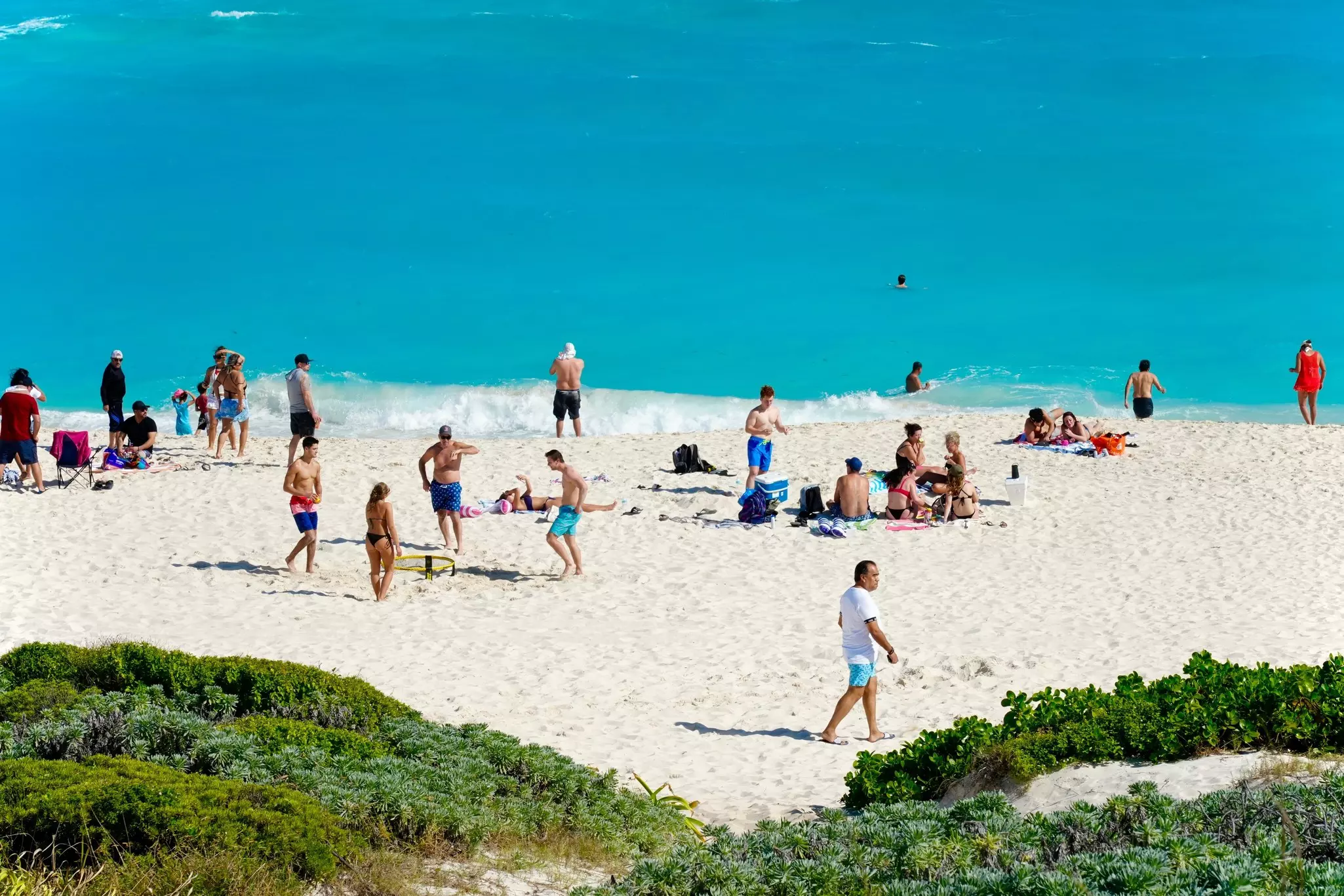 Cancun's warm turquoise Caribbean waters and white sand beaches help make it a mecca for local residents and tourists