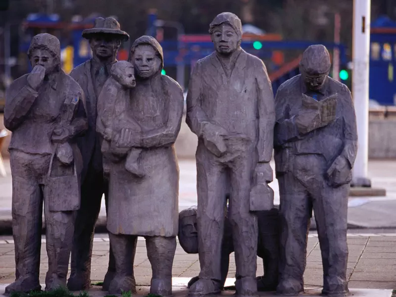 A sculpture of several standing figures in Seattle, Washington.