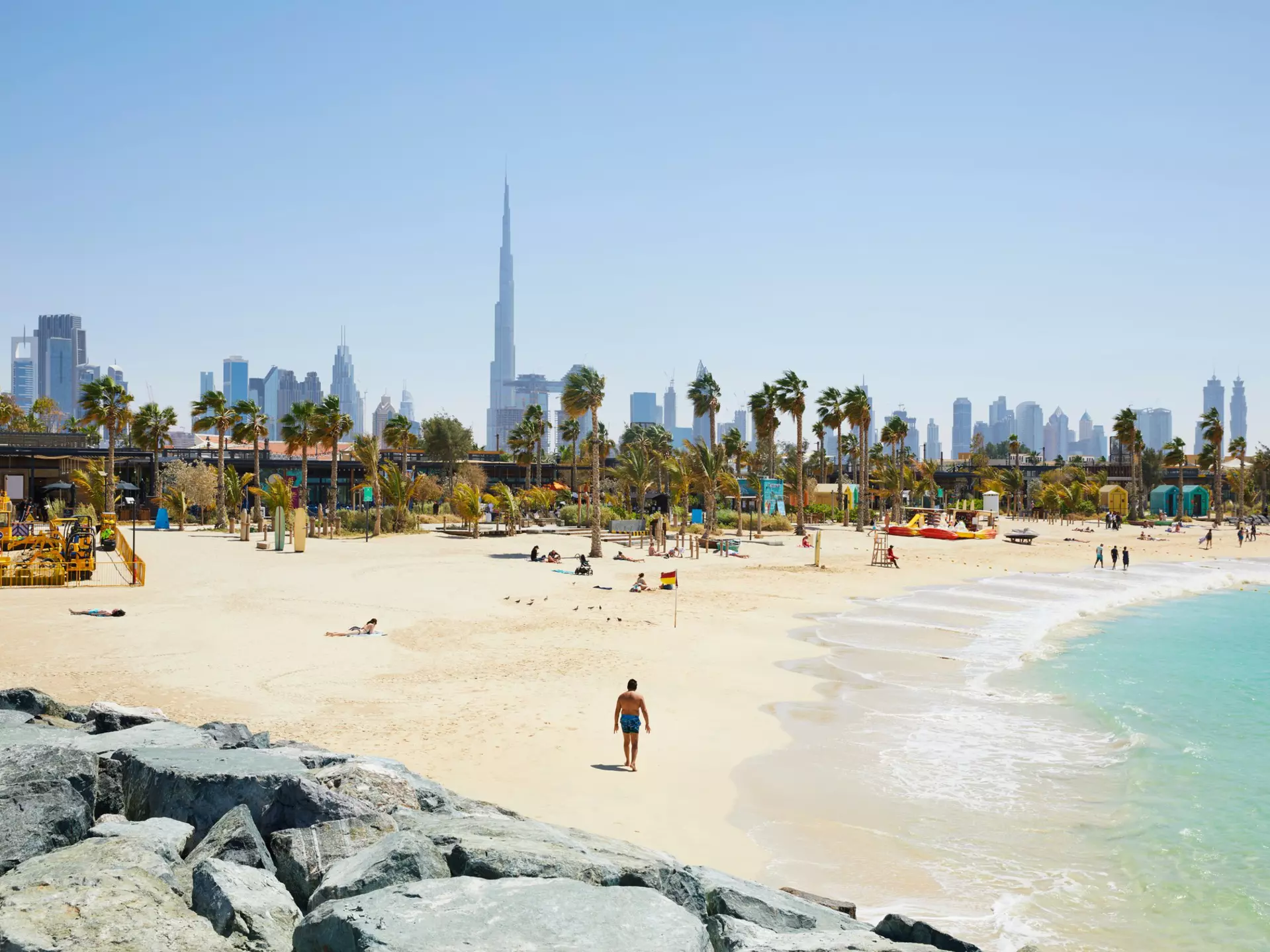The beach of 'La Mer' (The Sea) with in the background the skyline of Dubai, United Arab Emirates. R. de Bruijn_Photography/Shutterstock