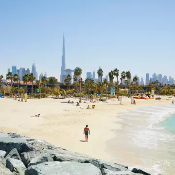The beach of 'La Mer' (The Sea) with in the background the skyline of Dubai, United Arab Emirates. R. de Bruijn_Photography/Shutterstock