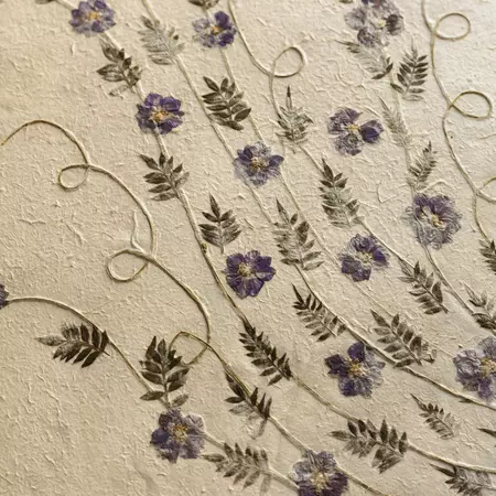 Flowers pressed into paper.