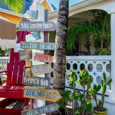 GRAND CASE, SAINT MARTIN - JANUARY 7: Restaurant sign in the street of Grand Case,  on January 7, 2025 on the French side of the Caribbean island of Saint Martin (Sint Maarten),  West Indies, License Type: media, Download Time: 2025-11-21T22:29:29.000Z, User: LP_ASouza, Editorial: true, purchase_order: 65050 - Digital Destinations and Articles, job: Lonely Planet, client: FTG St Martin, other: Amy Souza