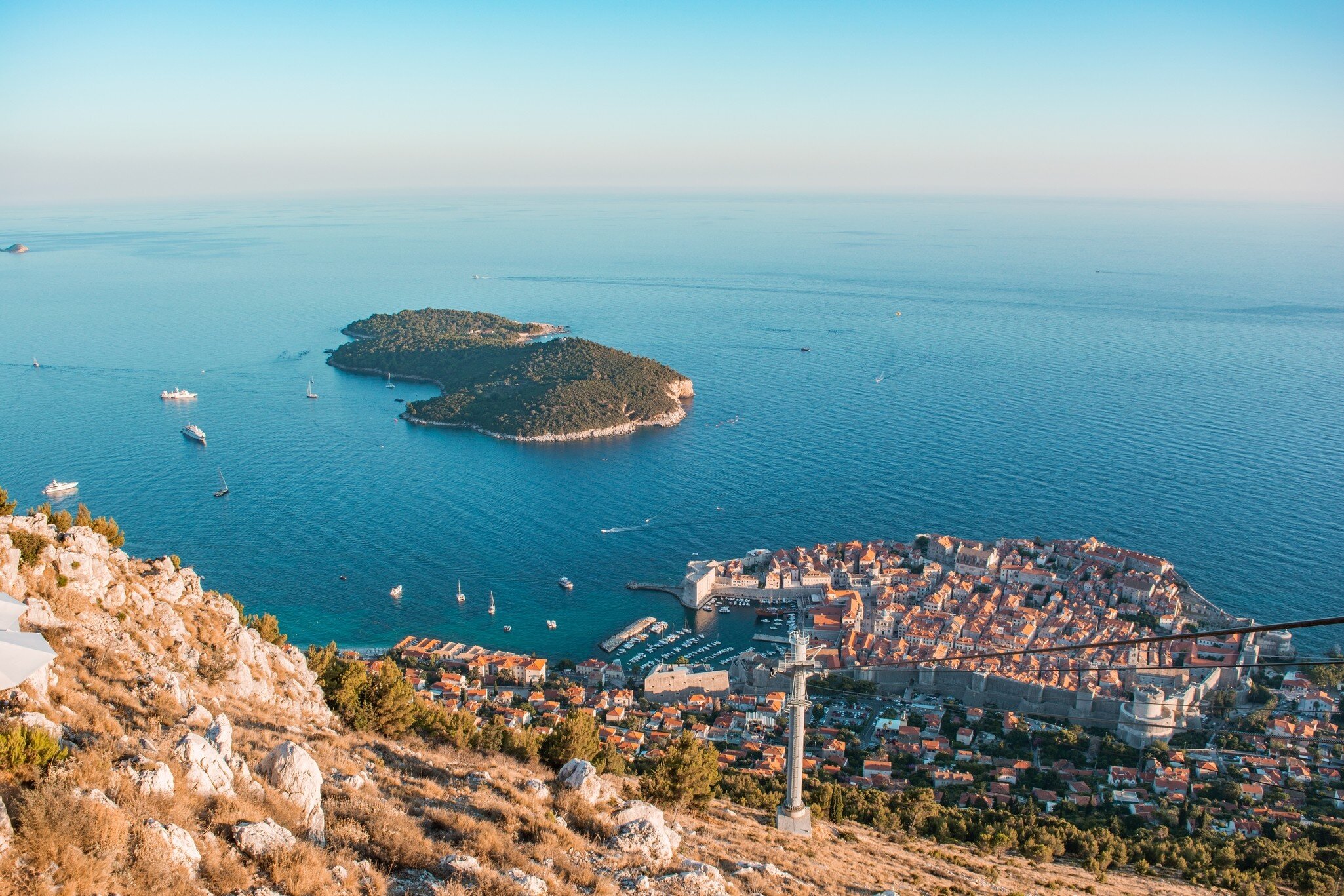 Old town of Dubrovnik with Lokrum island on background with red roofs; Shutterstock ID 151850840; Your name (First / Last): Josh Vogel; Project no. or GL code: 56530; Network activity no. or Cost Centre: Online-Design; Product or Project: 65050/75...