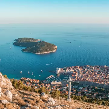Old town of Dubrovnik with Lokrum island on background with red roofs; Shutterstock ID 151850840; Your name (First / Last): Josh Vogel; Project no. or GL code: 56530; Network activity no. or Cost Centre: Online-Design; Product or Project: 65050/75...