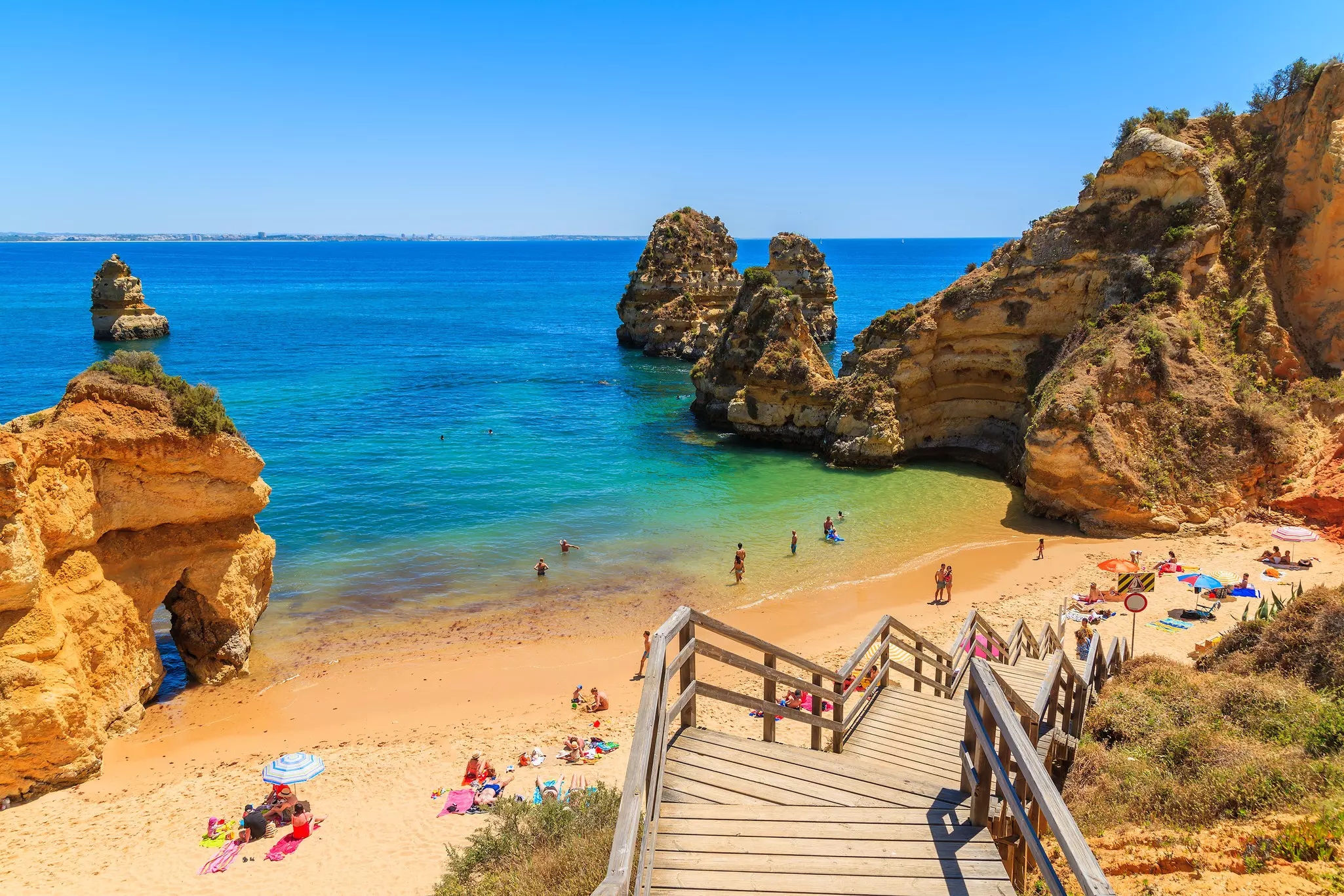 Wooden footbridge to beautiful beach Praia do Camilo, Portugal, License Type: media, Download Time: 2025-02-10T14:55:30.000Z, User: rhylton_redventures, Editorial: false, purchase_order: 65030 - Newsletter, job: Lonely Planet WIP, client: Lonely Planet WIP, other: Rhianydd Hylton