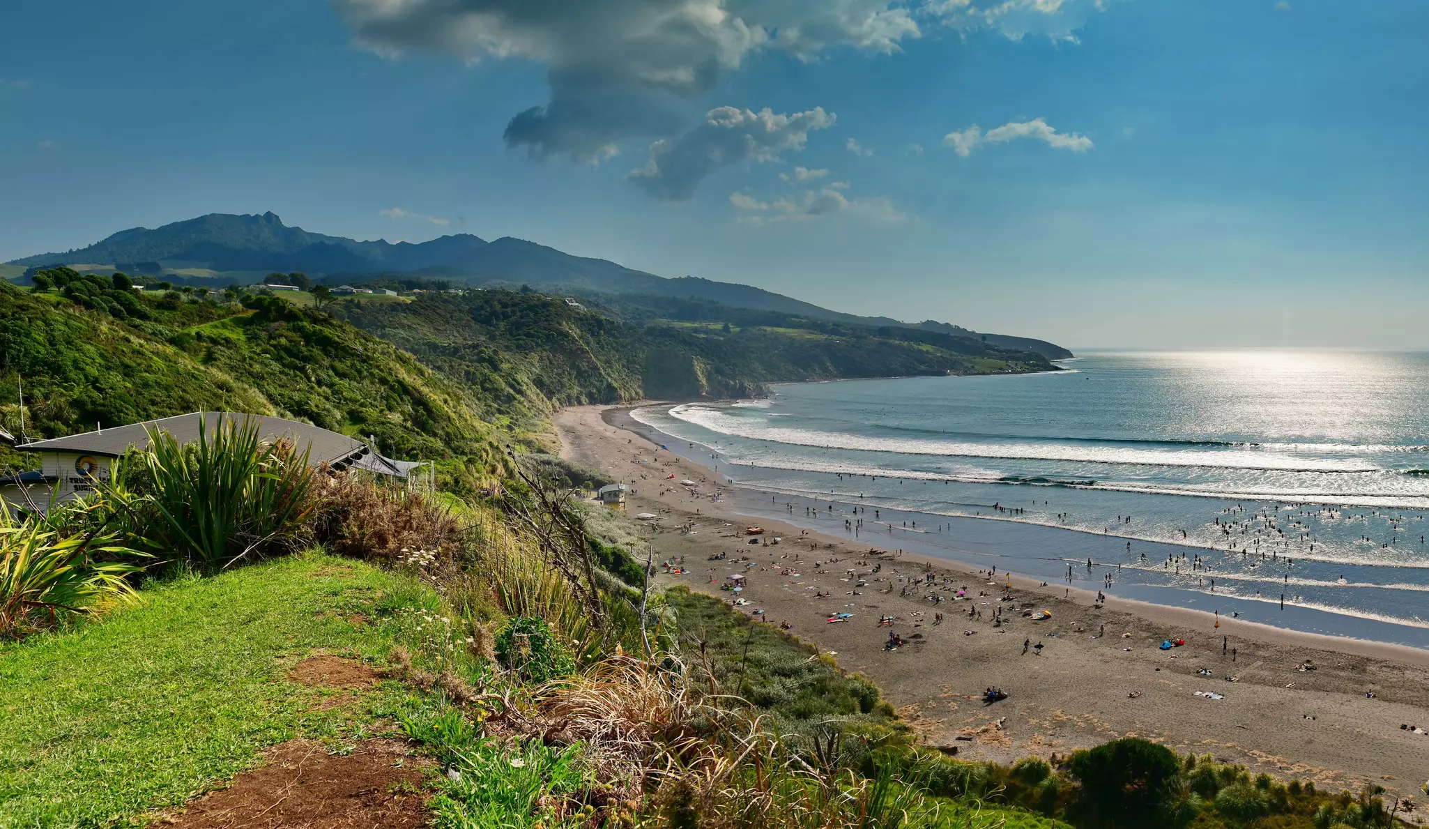 Black sand Ngarunui Beach in Raglan, New Zealand, popular for beach activities