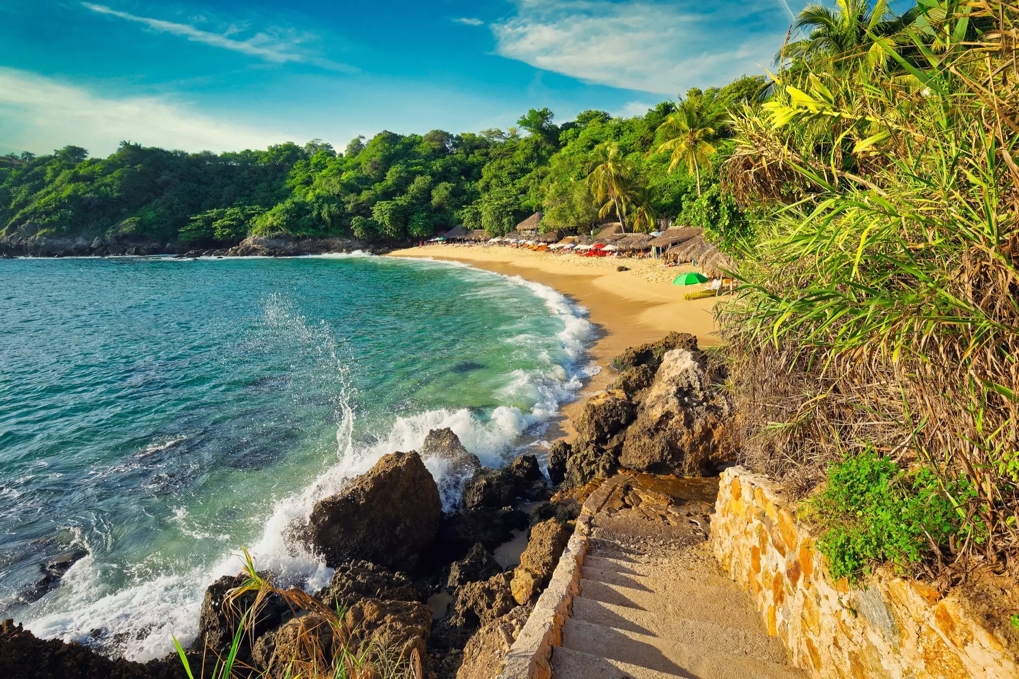 sunset shot of beautiful Playa Carizalillo beach in Puerto Escondido (Oaxaca State, Mexico) on the Pacific Ocean coast
