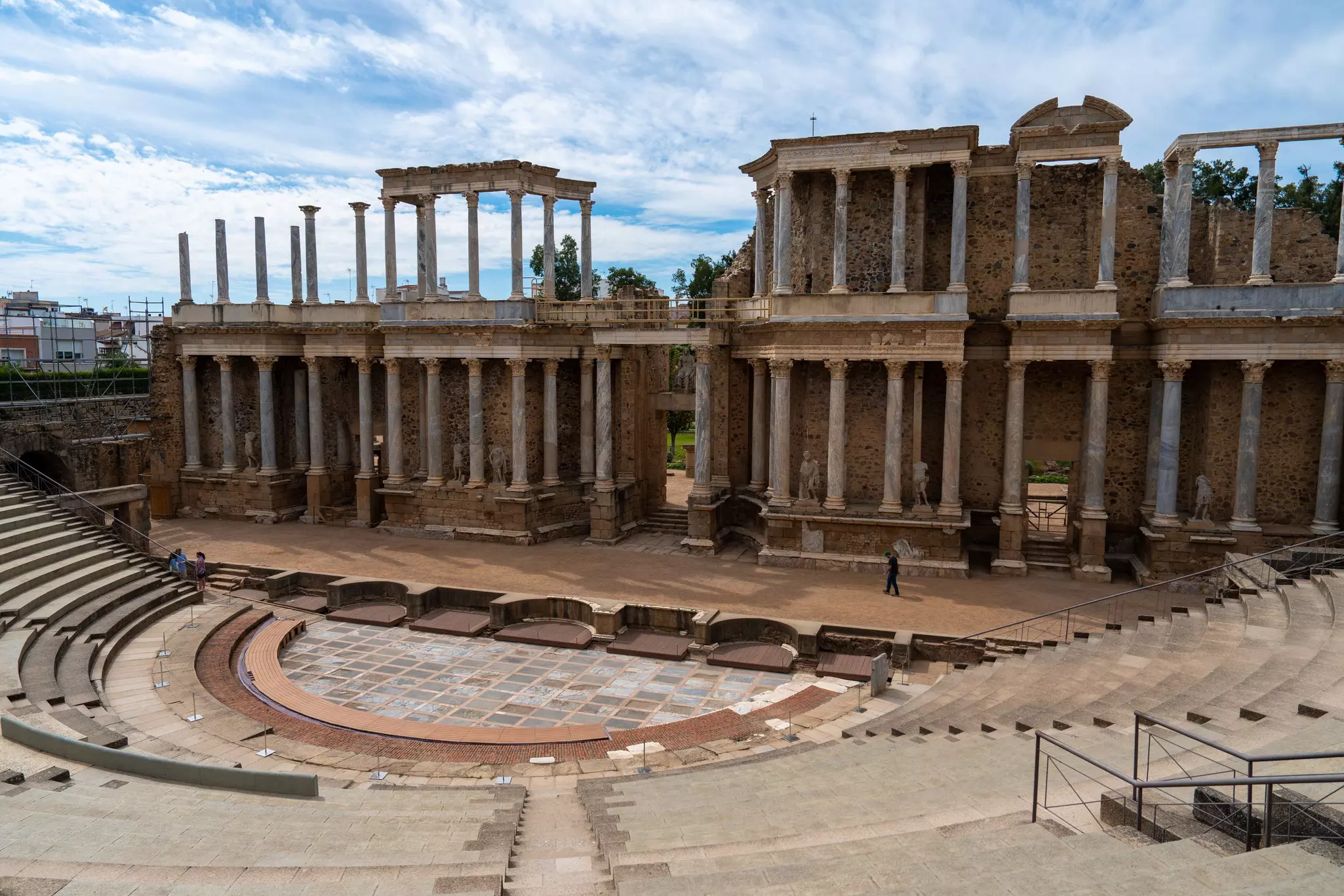 Roman amphitheater ruins on a sunny day.